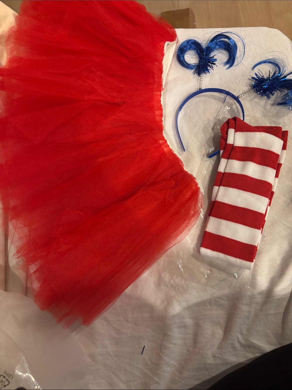 Adult one size redTutu Costume Set with Headband and Red-White Striped sock.